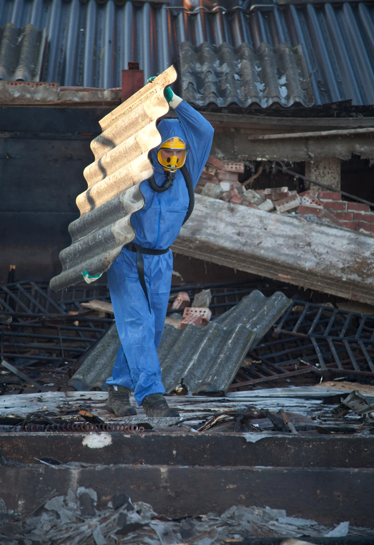 Licensed asbestos removal worker in full PPE safety equipment in Perth