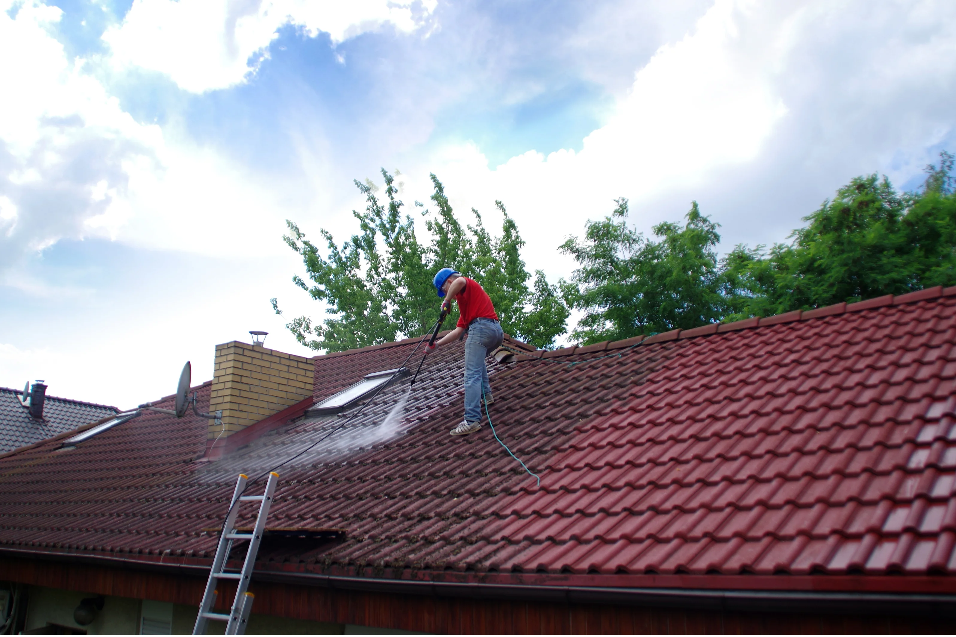 Professional high-pressure roof cleaning in progress on Australian tiled roof